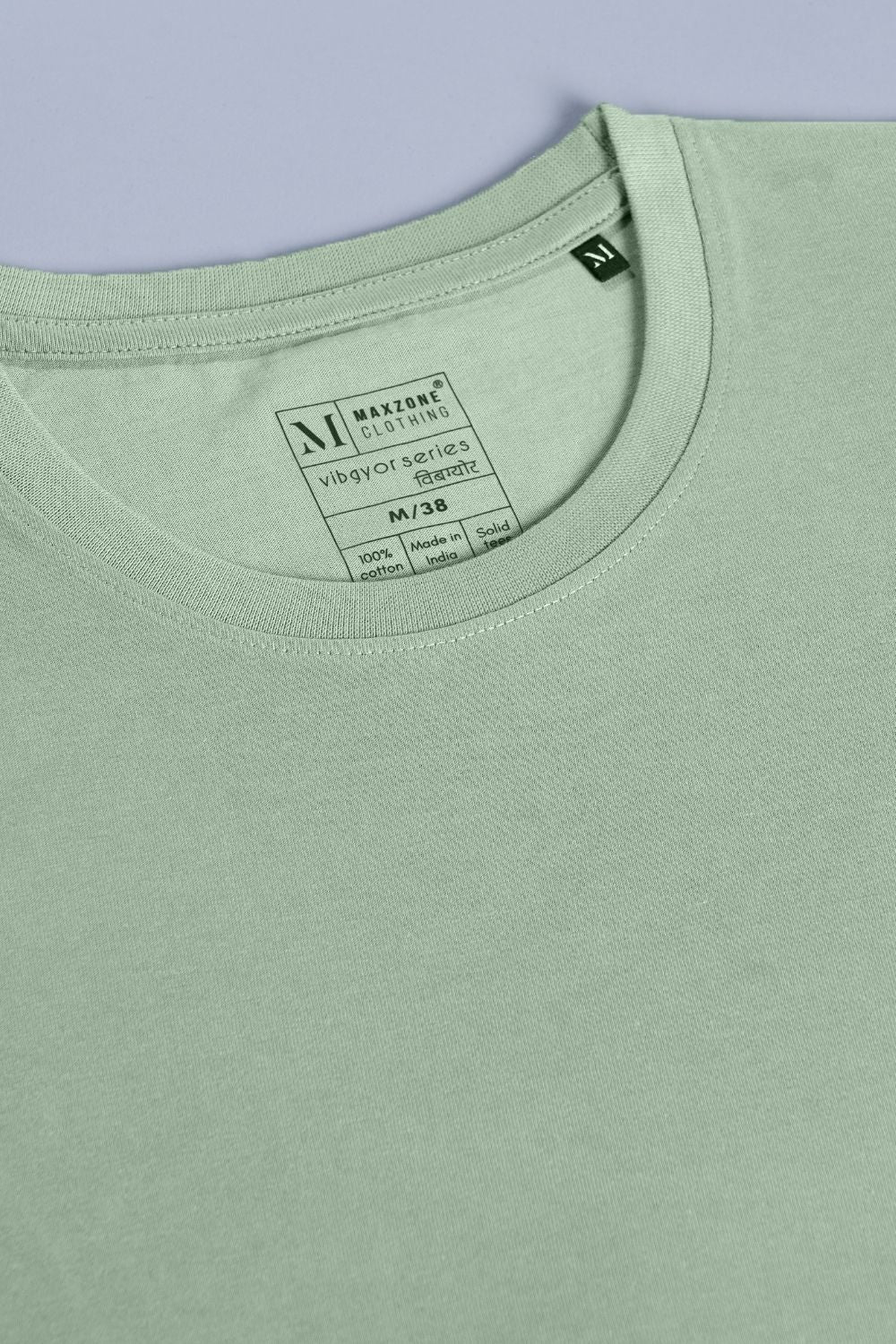 Green colored, cotton Graphic T shirt for men with half sleeves and round neck, product close up.