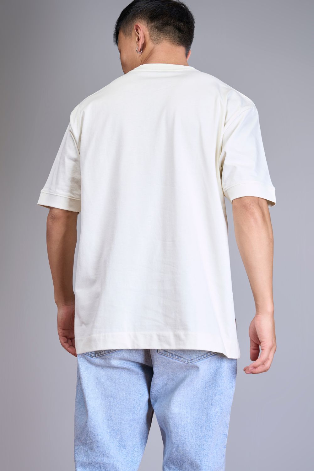 Light pink colored, Solid T shirt for men, with half sleeves and round neck, front view.