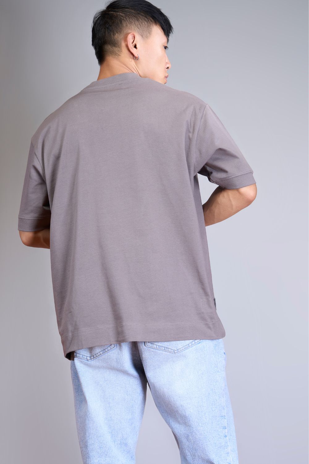 Light pink colored, Solid T shirt for men, with half sleeves and round neck, product close up.