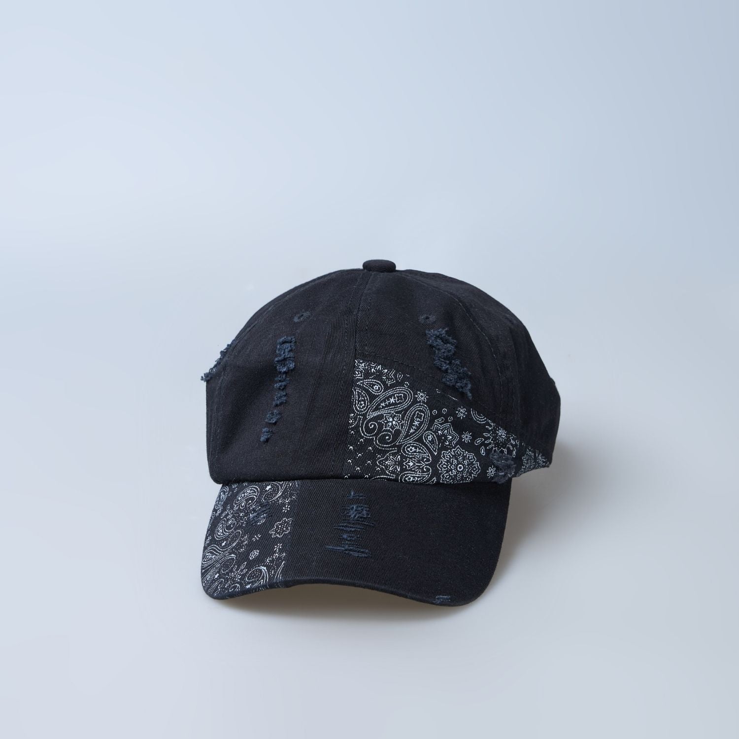 Black colored design patterned cap for men, design detail.