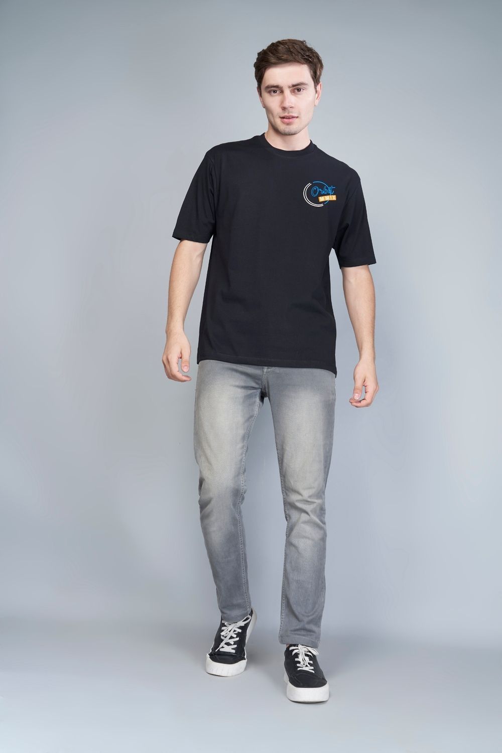 Cotton oversized T shirt for men in the solid color Dark Charcoal with half sleeves and crew neck, front view.