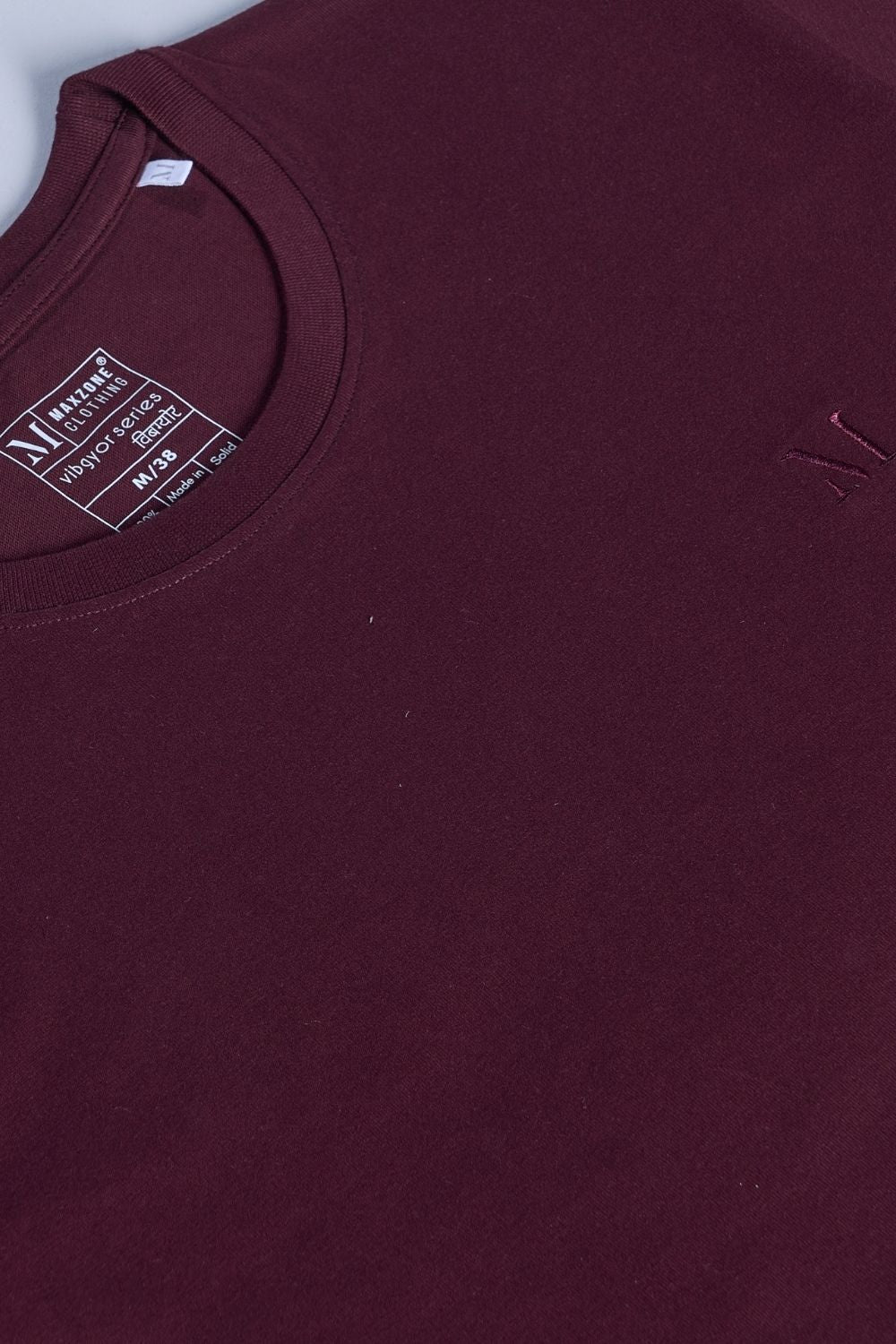Heng Maroon colored, Solid T shirt for men, with half sleeves and round neck, product close up.