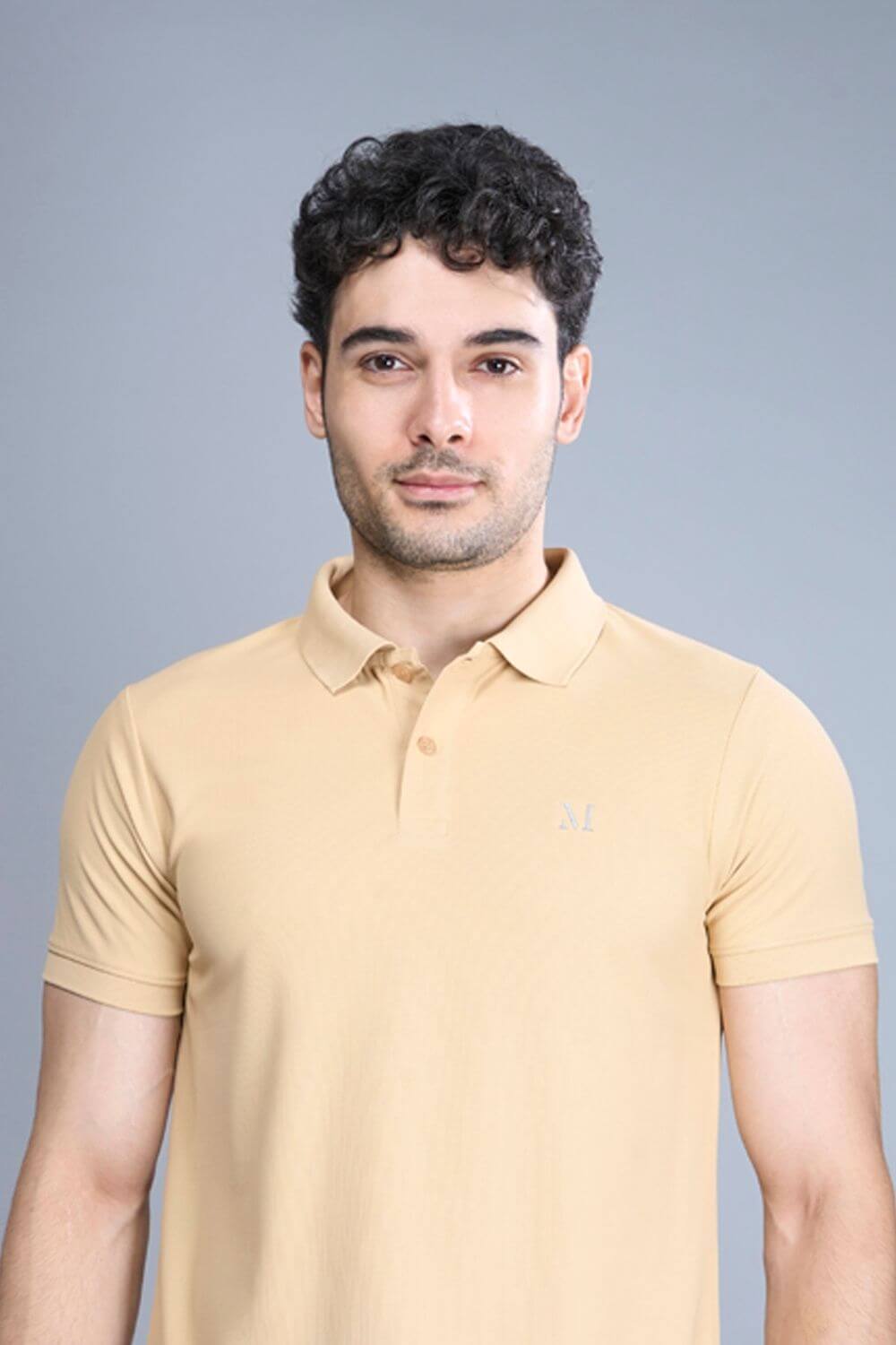 Bisque colored, Smart Tech Polo T-shirts for men with collar and half sleeves, front view.
