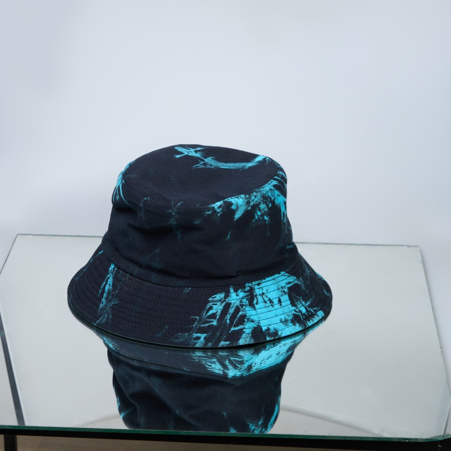 Blue and green colored, lightweight bucket hat for men design detail.