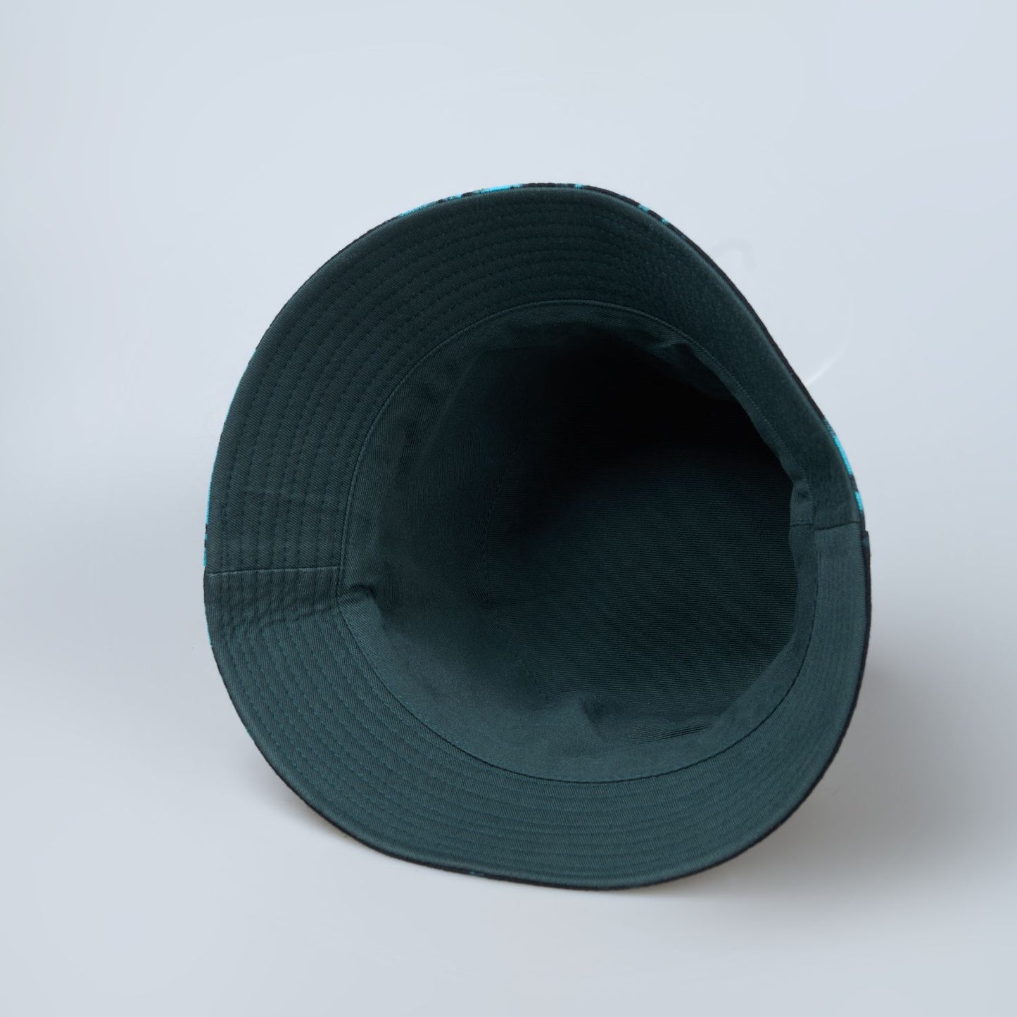 Blue and green colored, lightweight bucket hat for men, inside view.