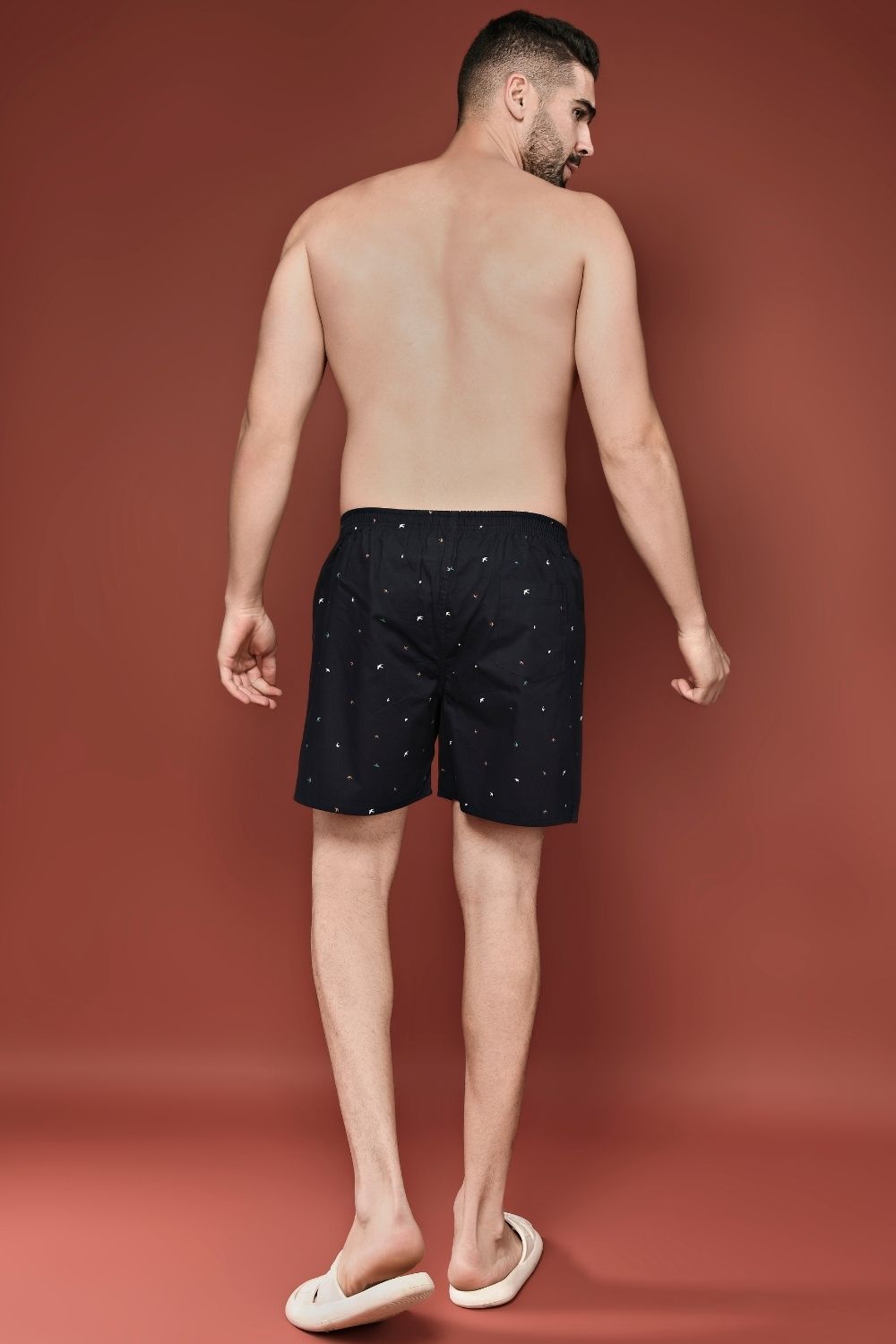 Teal Navy colored all over printed cotton boxer for men with back pockets, back.