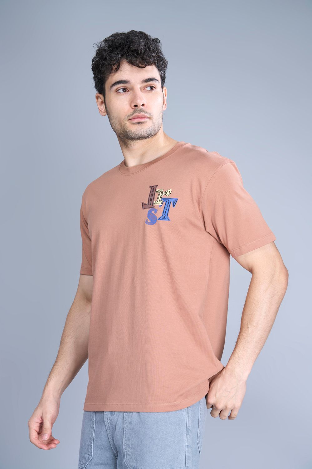 Cotton oversized T shirt for men in the solid color Café cream with half sleeves and crew neck, side view.