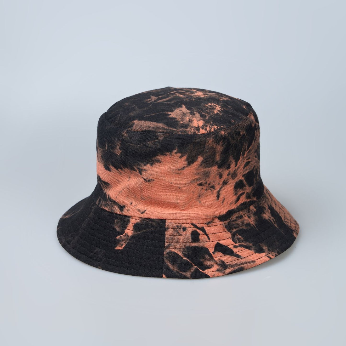 Black and orange colored, lightweight bucket hat for men, front view.