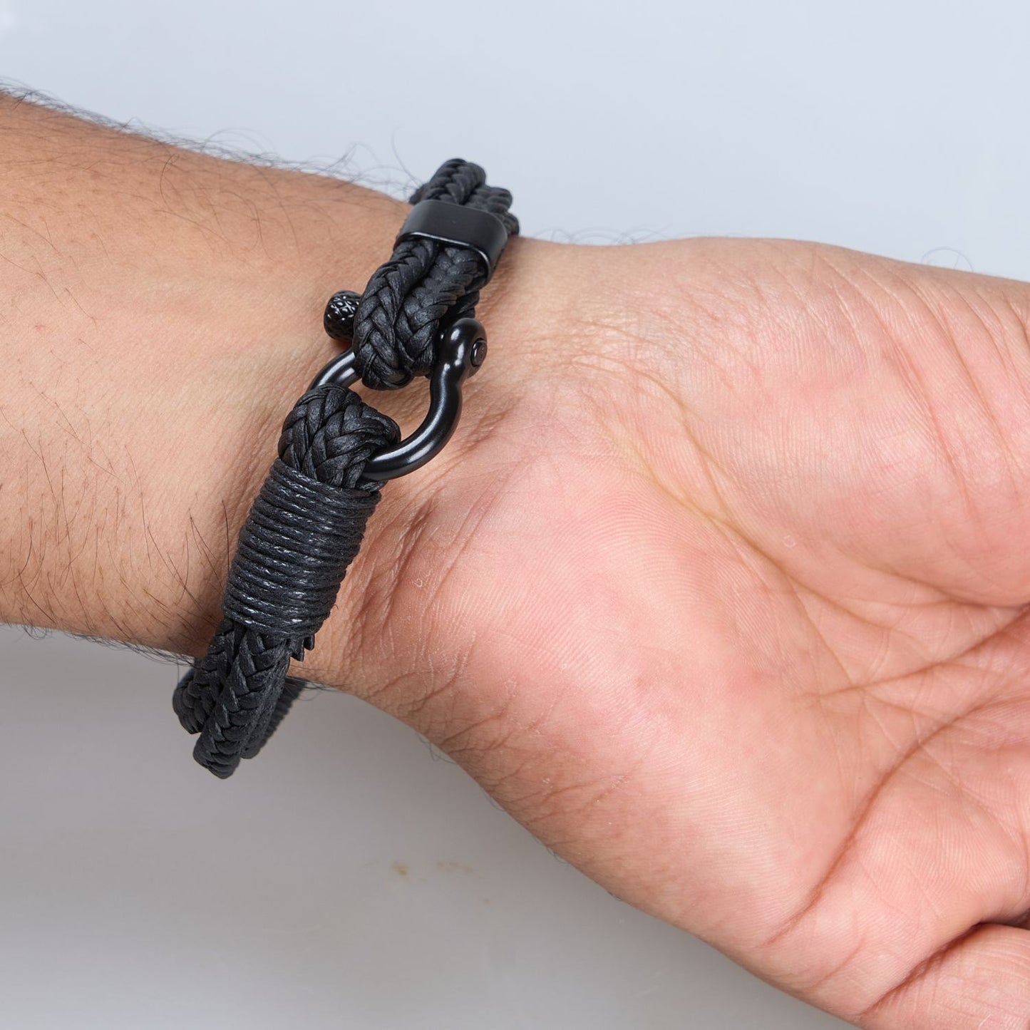 Black colored Multi-string Bracelet for men, with screw clasp, Back view.