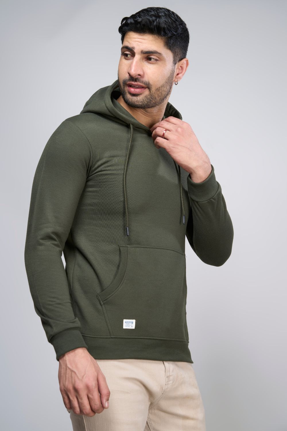 Olive colored, hoodie for men with full sleeves and relaxed fit, pocket view.