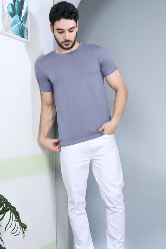 A model wearing Vista Blue colored, solid t shirt for men with round neck and half sleeves.