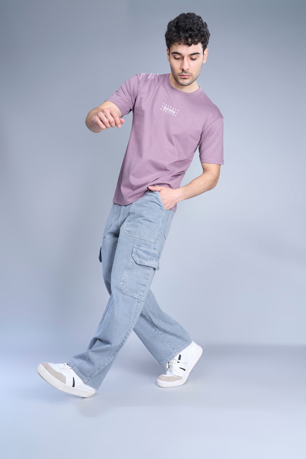 Cotton oversized T shirt for men in the solid color Opera Mauve with half sleeves and crew neck, side view.