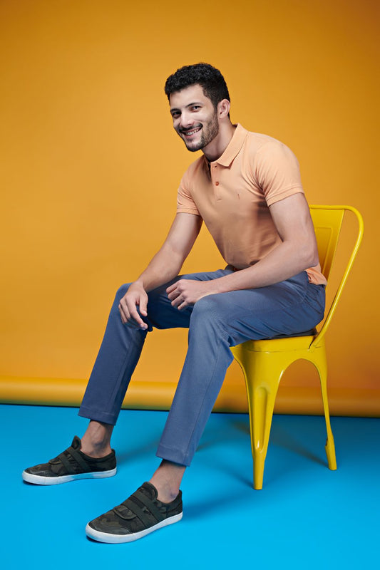 Mild orange colored, relaxed edition Polo T-shirts for men with collar and half sleeves.