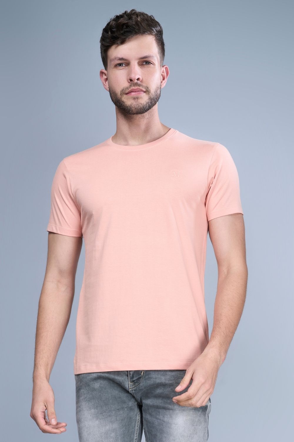 Light orange colored, Solid T shirt for men, with half sleeves and round neck.