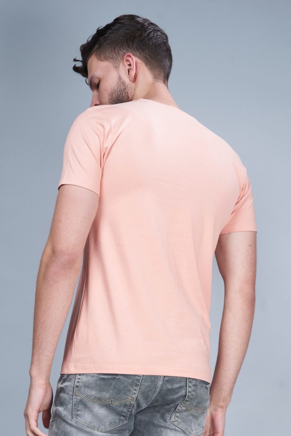 Light orange colored, Solid T shirt for men, with half sleeves and round neck, back view.