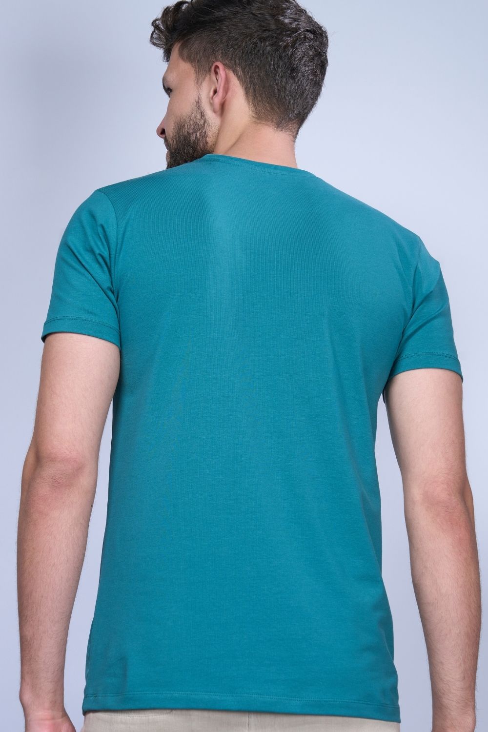 Cotton Stretch T shirt for men in the the solid color British Green with half sleeves and round neck, back view.