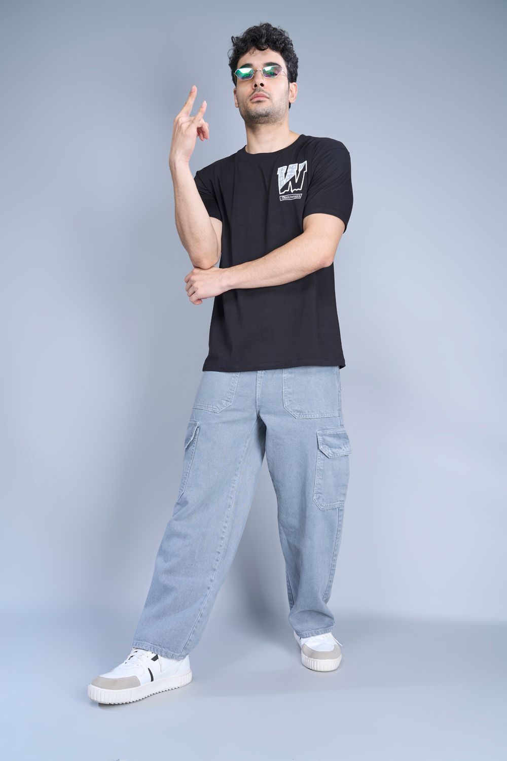 Cotton oversized T shirt for men in the solid color black with half sleeves and crew neck, front view.