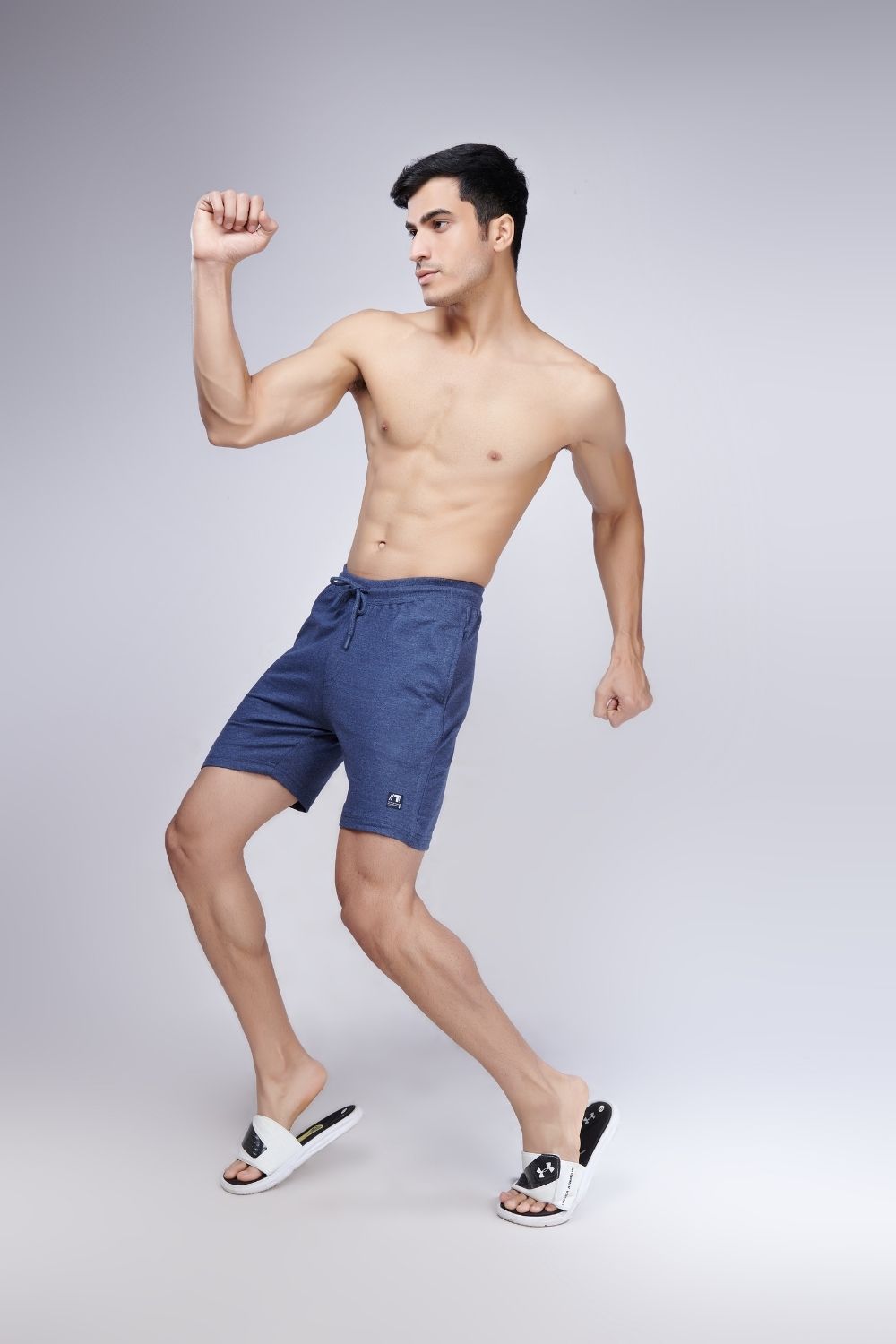 A model wearing Dreamer: Blue colored Label Free Cotton Short Boxers  for Men with back pocket.