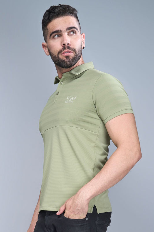 Fern Green colored, constructed polo T shirt for men with half sleeves and collar.