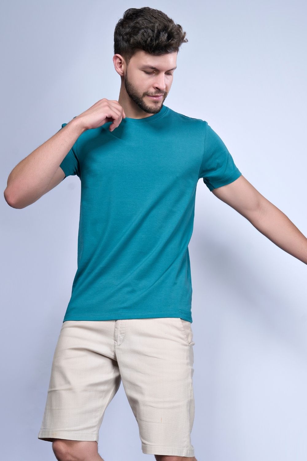 Cotton Stretch T shirt for men in the the solid color British Green with half sleeves and round neck.