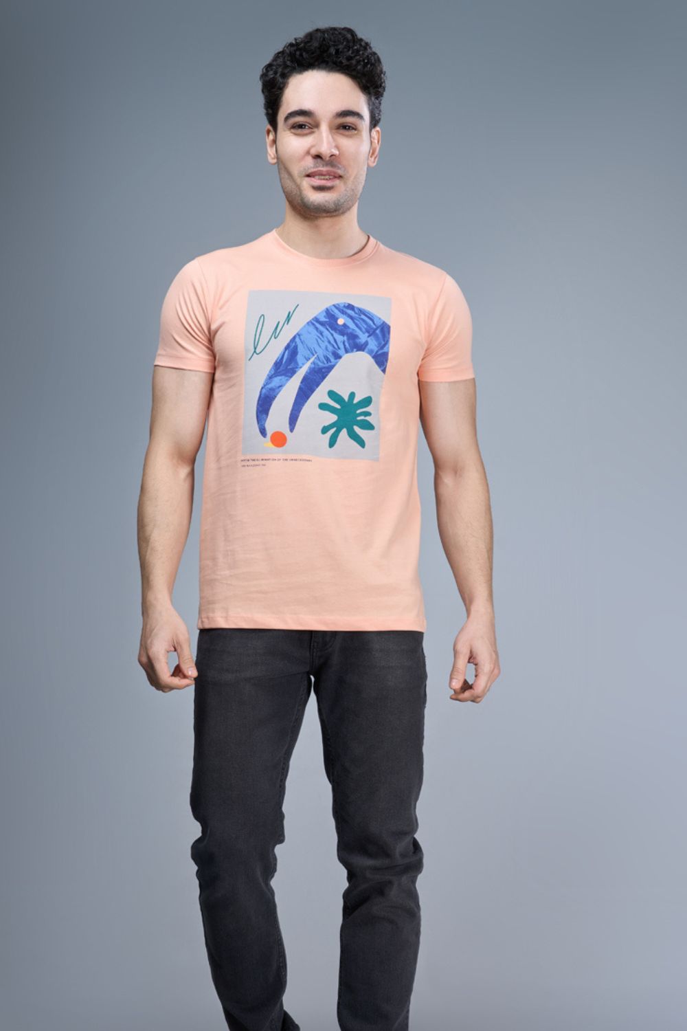 Peach colored, cotton Graphic T shirt for men, half sleeves and round neck, front view.
