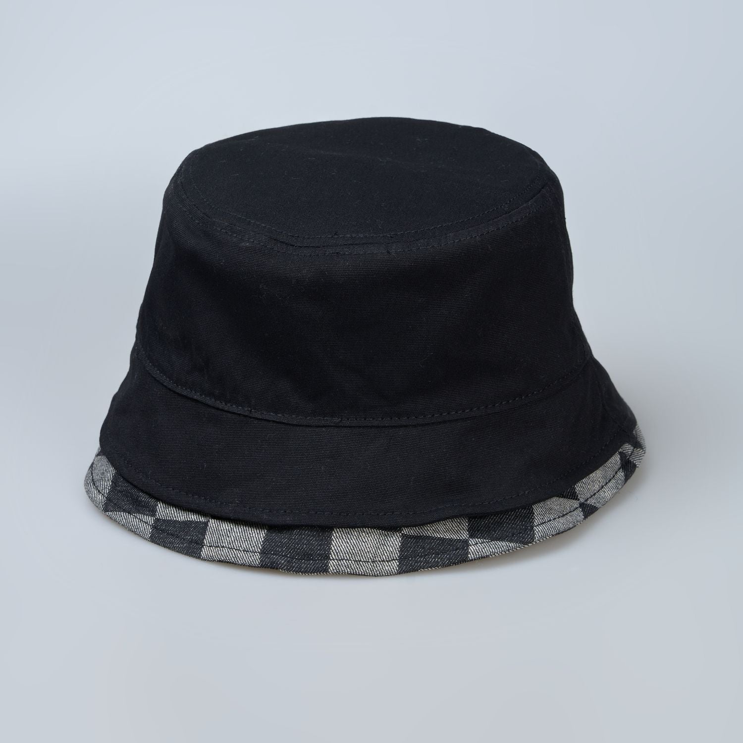 Black colored, chequered pattern, lightweight bucket hat for men, back view.