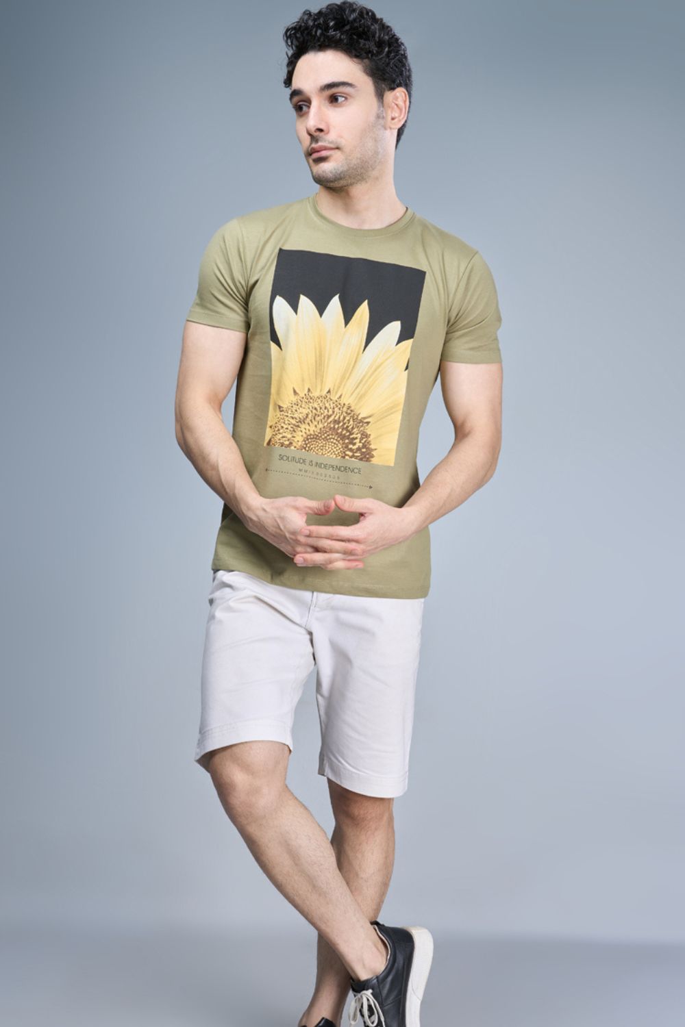 Olive Green colored, cotton Graphic T shirt for men, half sleeves and round neck, front view.