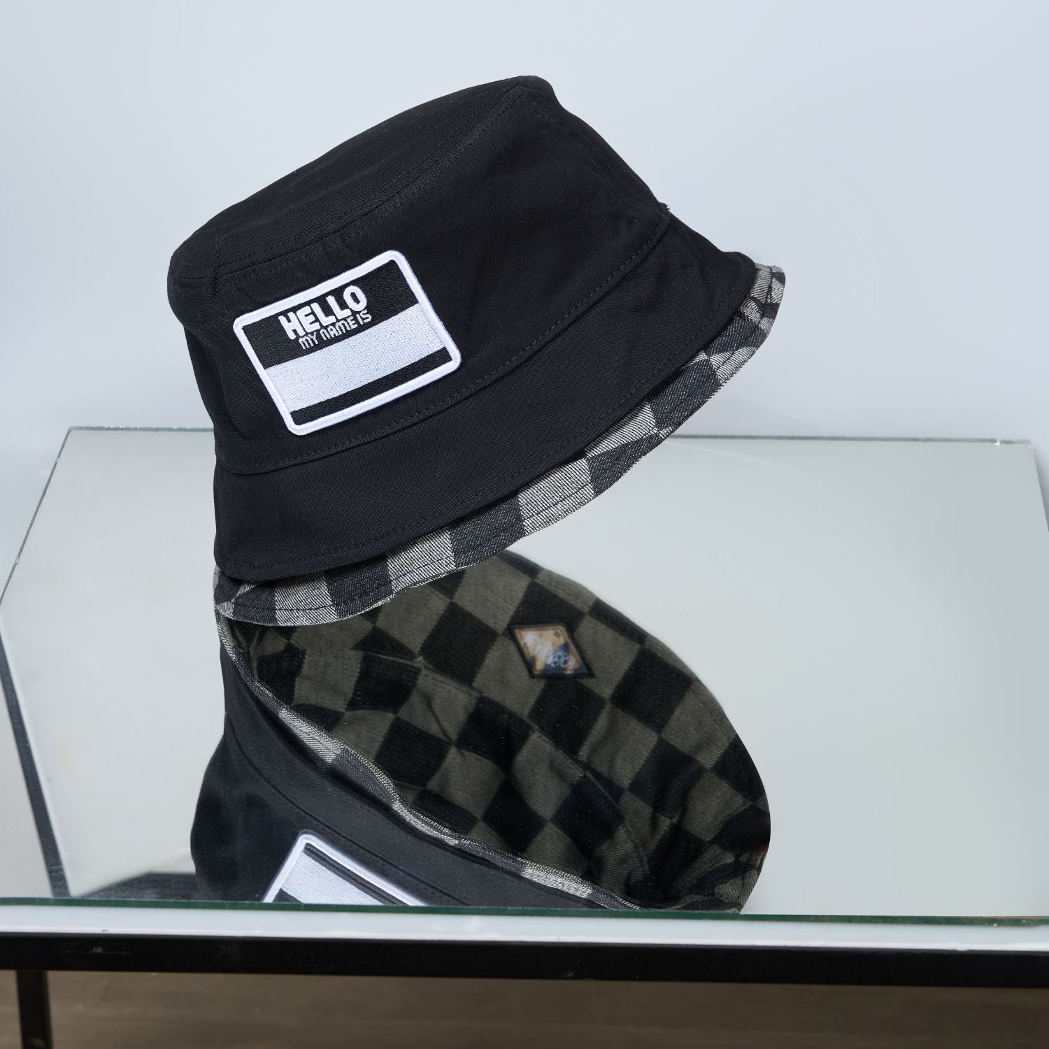 Black colored, chequered pattern, bucket hat for men