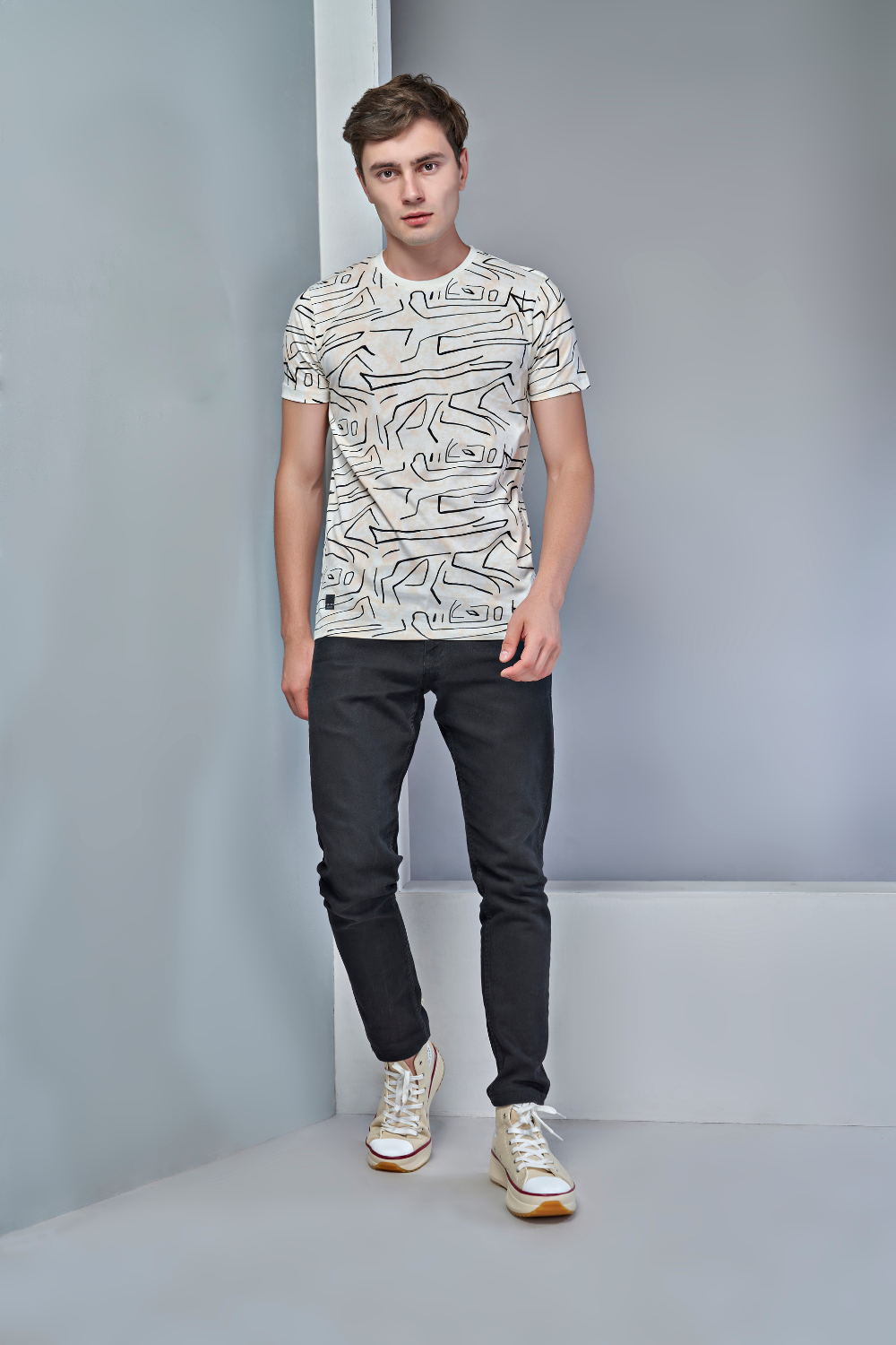 Full View of Powder white colored all over print T shirt for men with short sleeves and round neck.