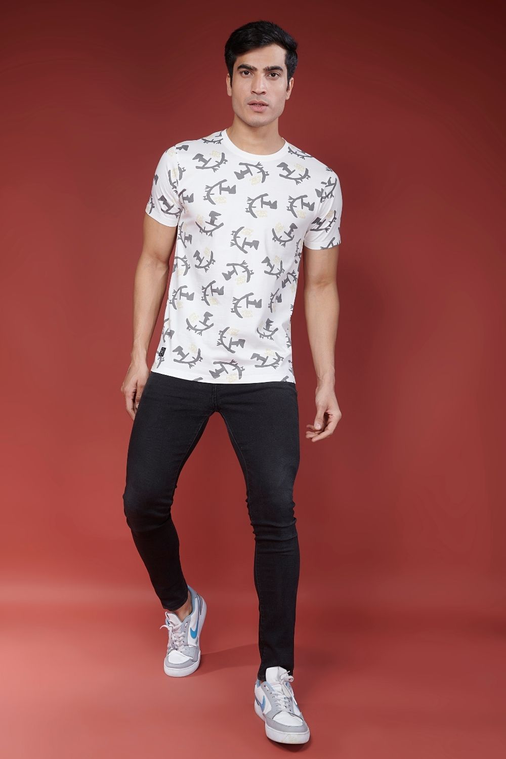 Full view of white colored all over print T shirt for men with short sleeves and round neck.