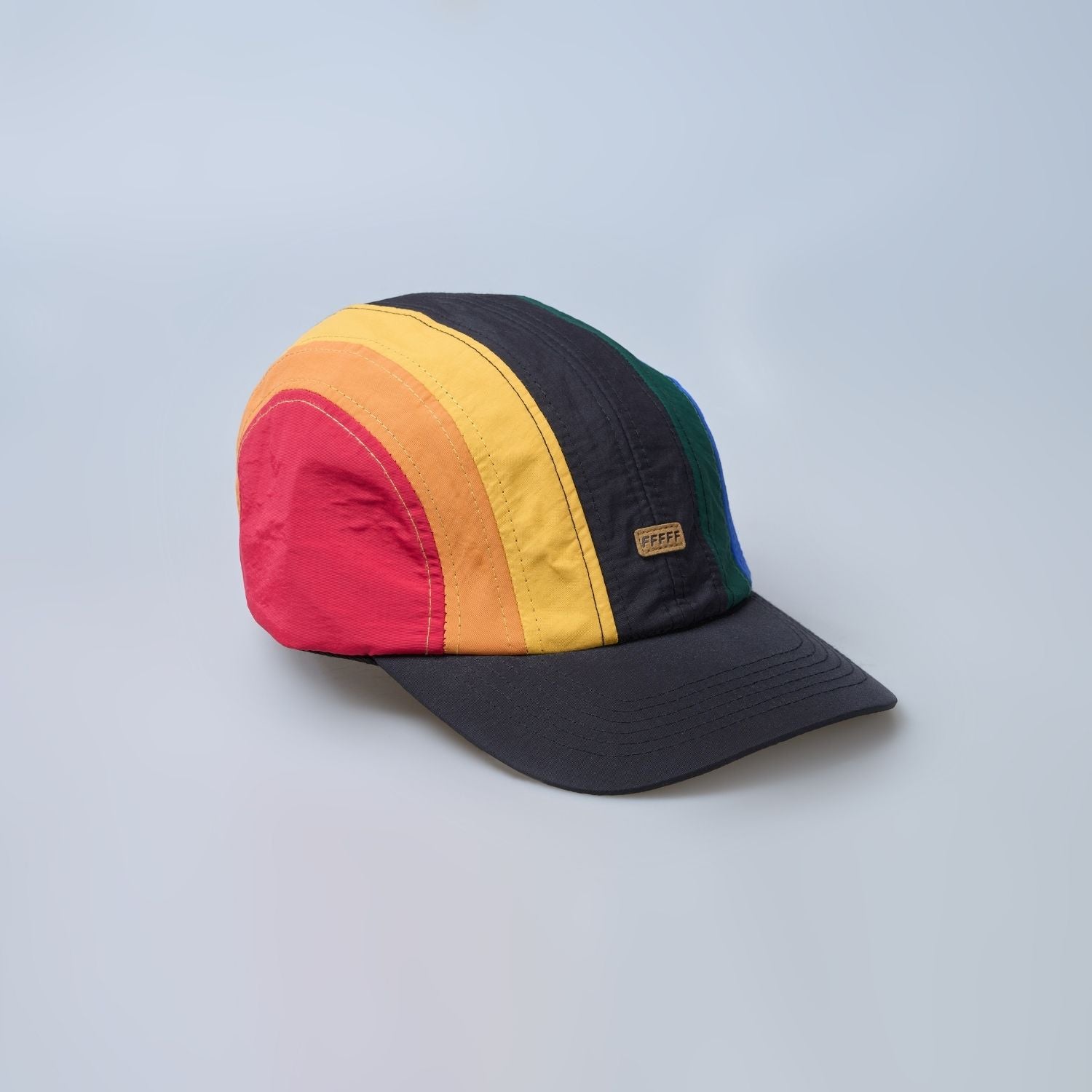 Multi colored, wide brim cap for men with adjustable strap, product view.