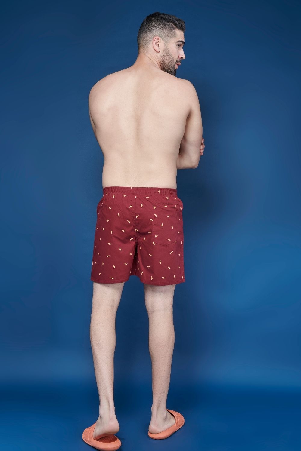 chilly red colored all over printed cotton boxer for men with back pockets, back.