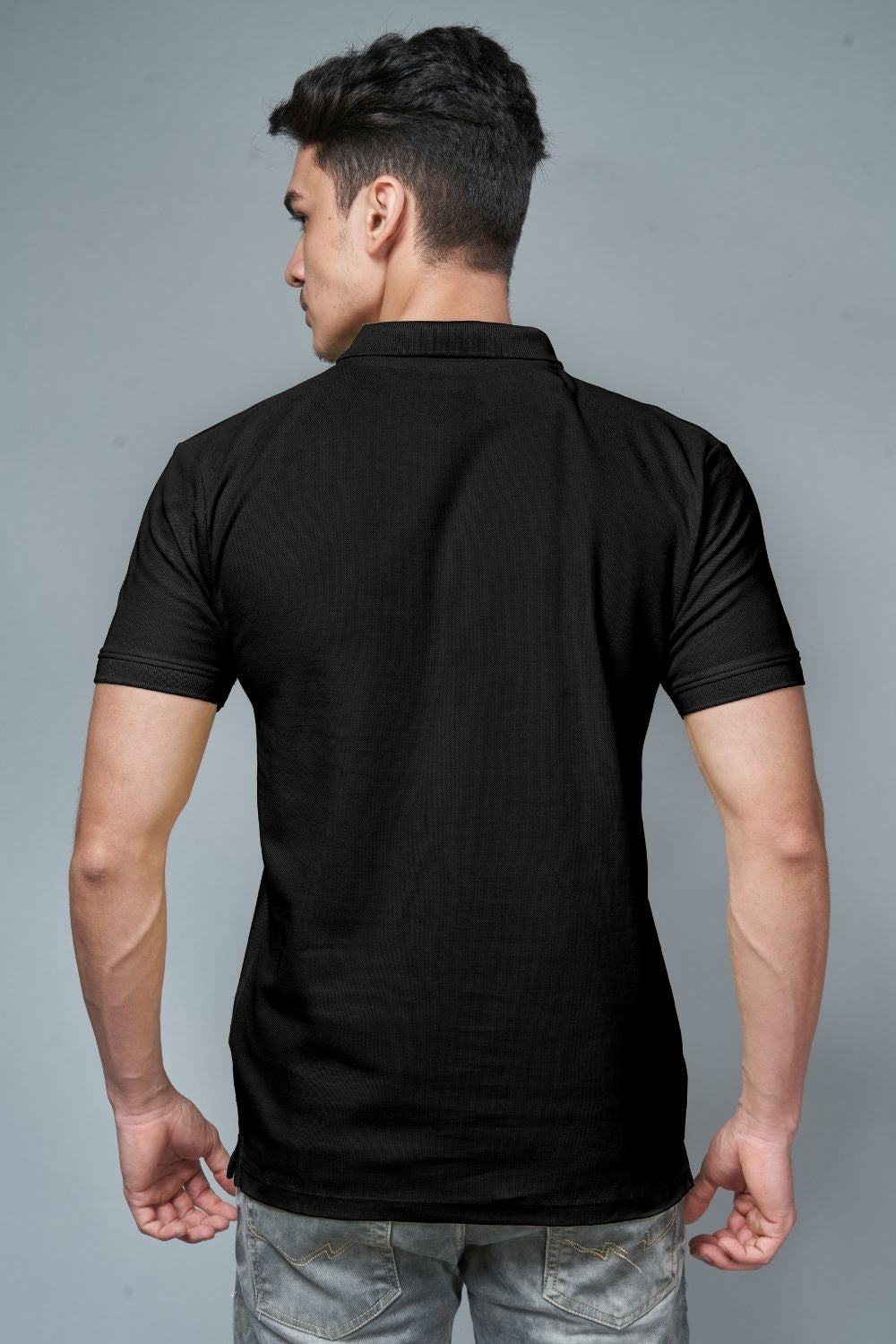Black colored, identity Polo T-shirts for men with collar and half sleeves, back view.