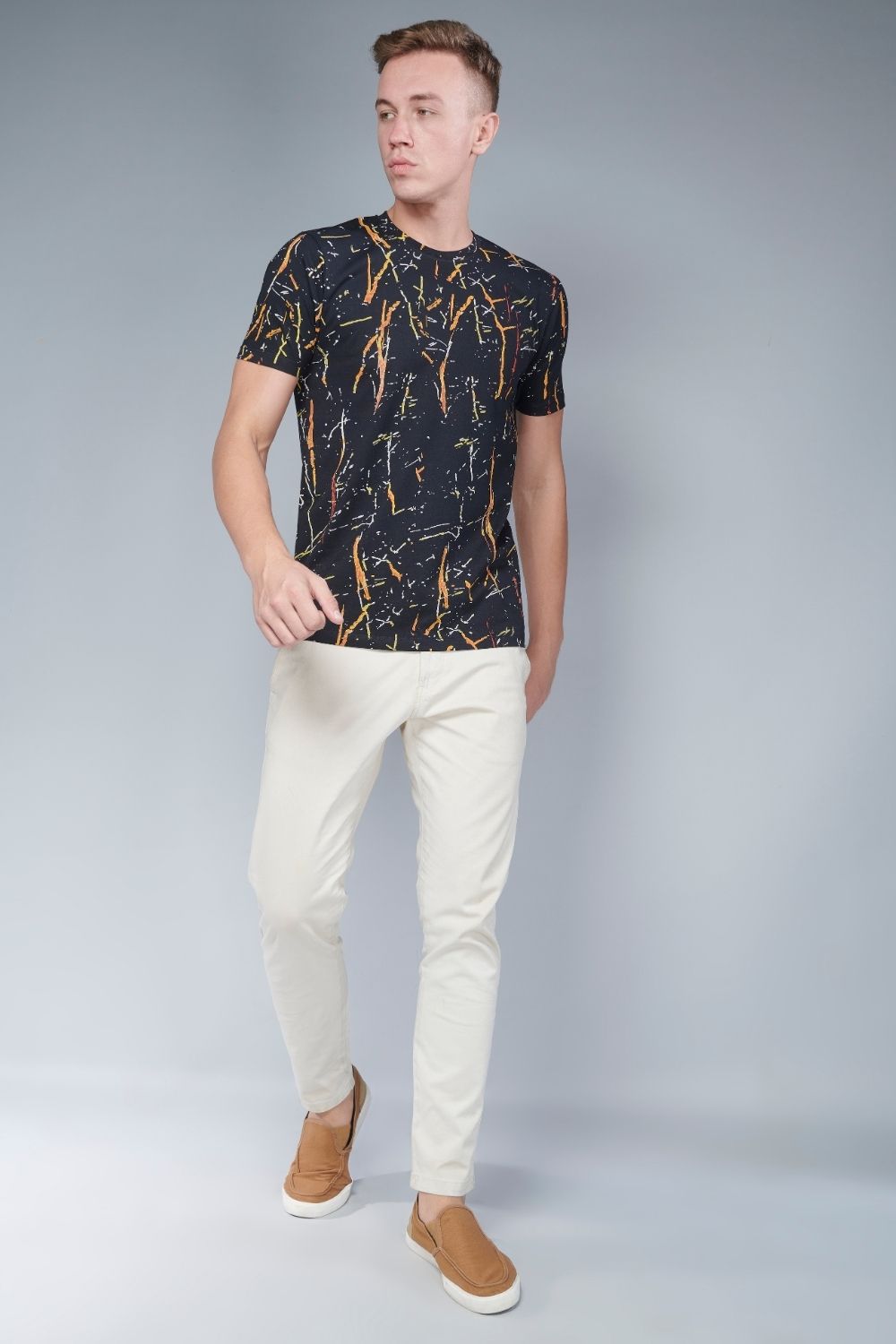Black color, sprinkle patterned all over print T shirt for men with half sleeves and round neck.