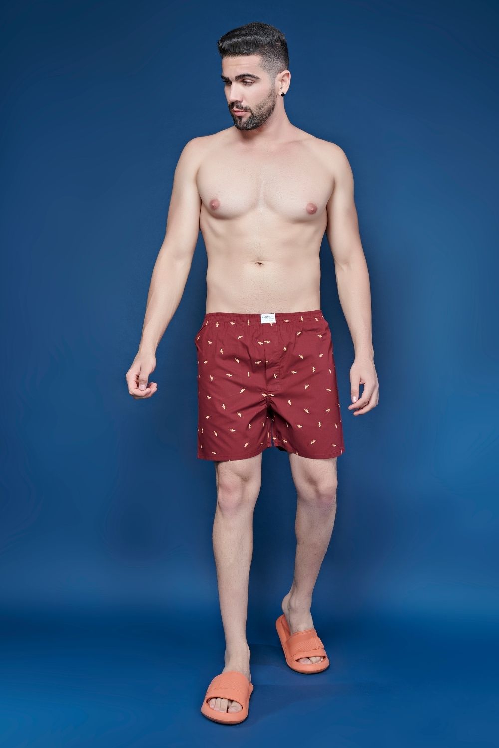 chilly red colored all over printed cotton boxer for men with back pockets, front.
