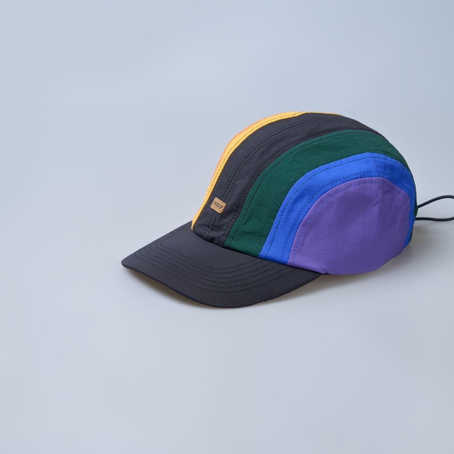 Multi colored, wide brim cap for men with adjustable strap.
