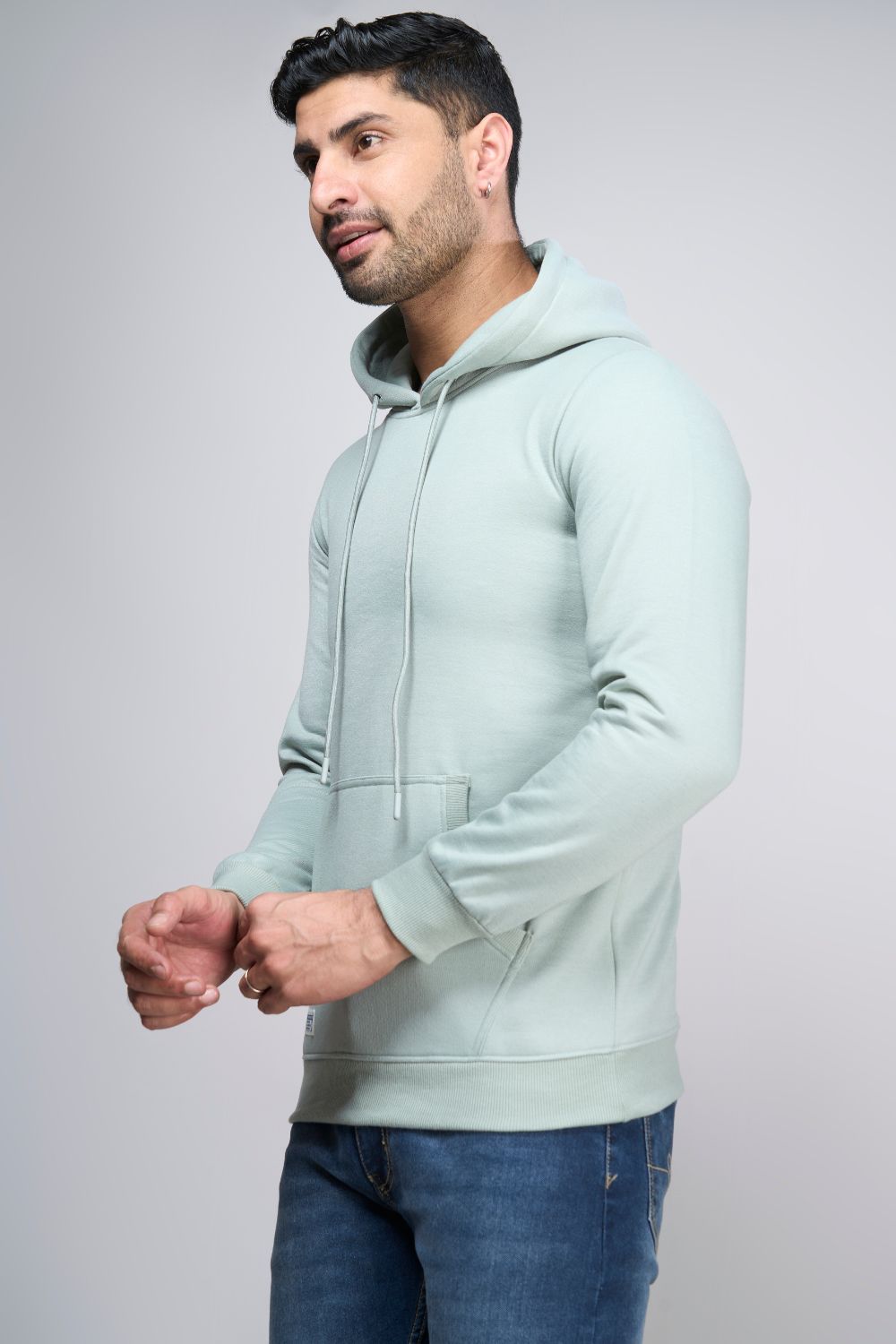 Sea Green colored, hoodie for men with full sleeves and relaxed fit, side view.