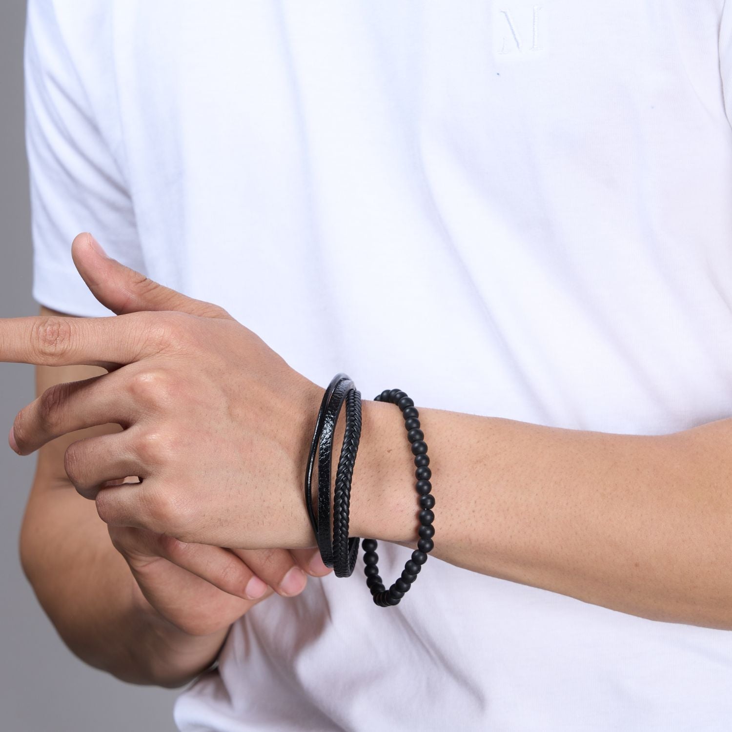 Black colored Multi-style Bracelet for men, with magnetic clasp, side view.