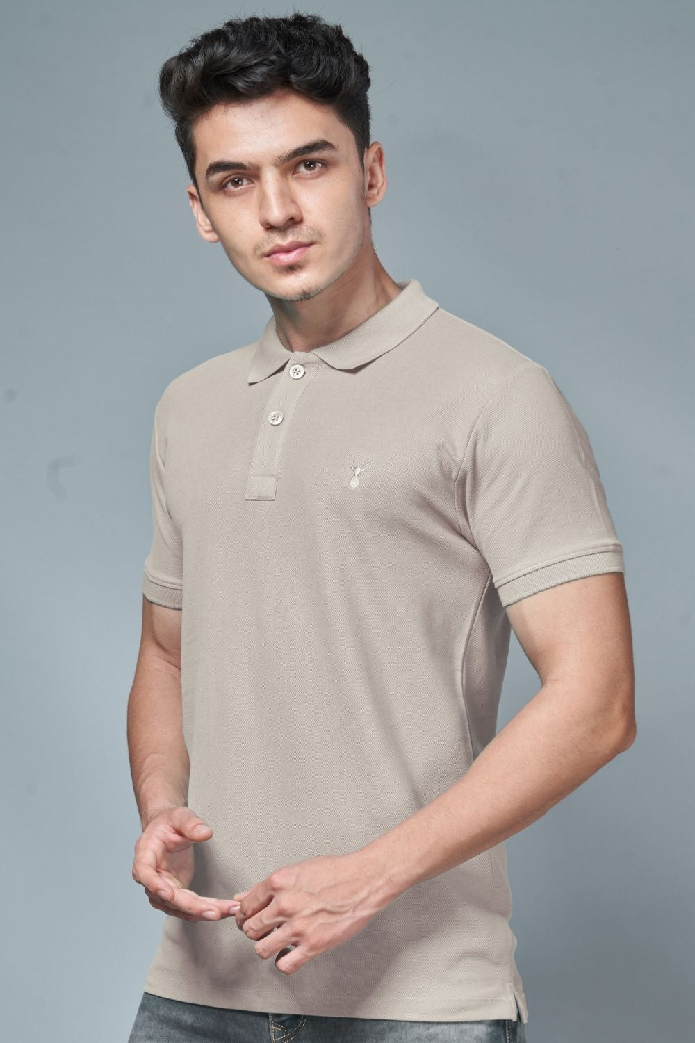 A model wearing Moon light colored, identity Polo T-shirts for men with collar and half sleeves.