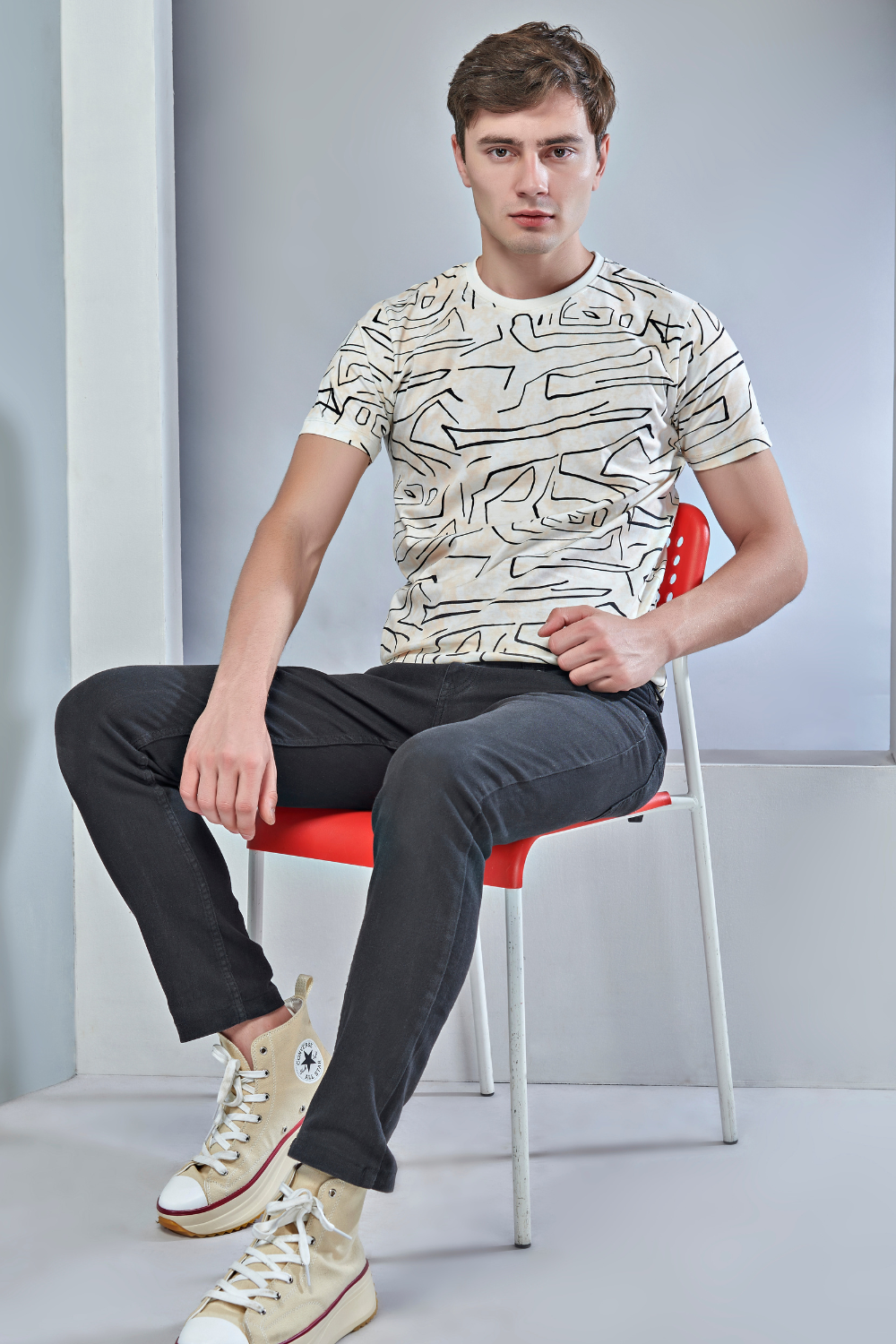 Powder white colored all over print T shirt for men with short sleeves and round neck.
