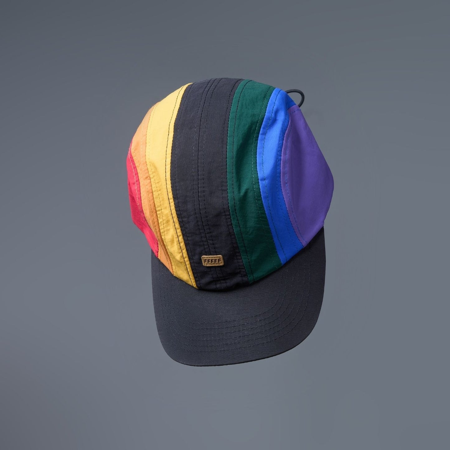 Multi colored, wide brim cap for men with adjustable strap, design details.