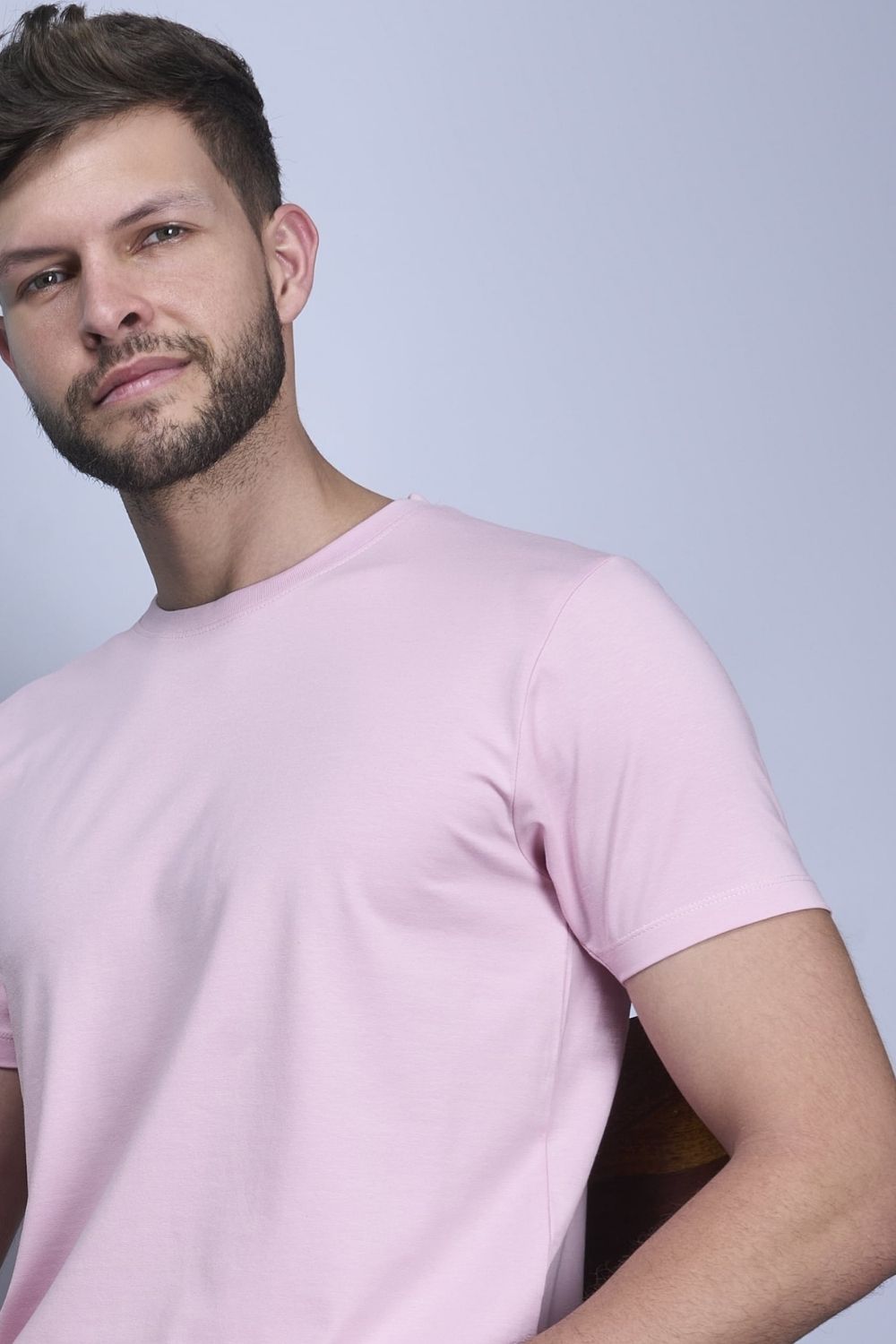 Cotton Stretch T shirt for men in the solid color lilac shade with half sleeves and round neck, side view.