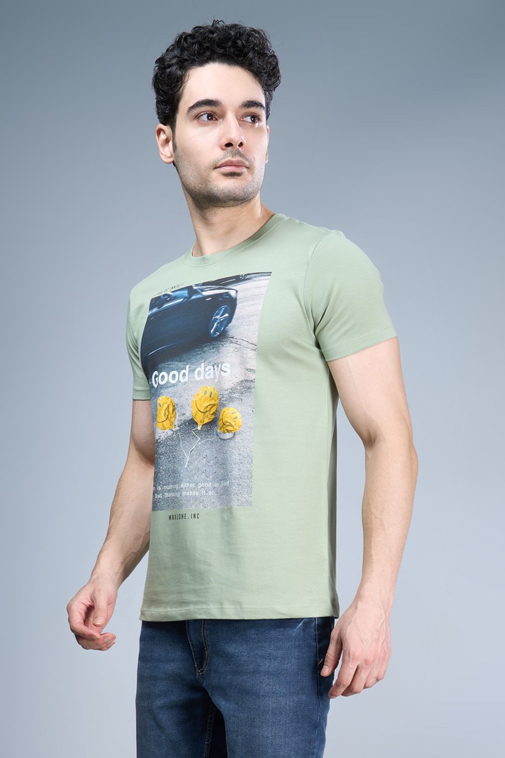 Cyan green colored, cotton Graphic T shirt for men, half sleeves and round neck, side view.