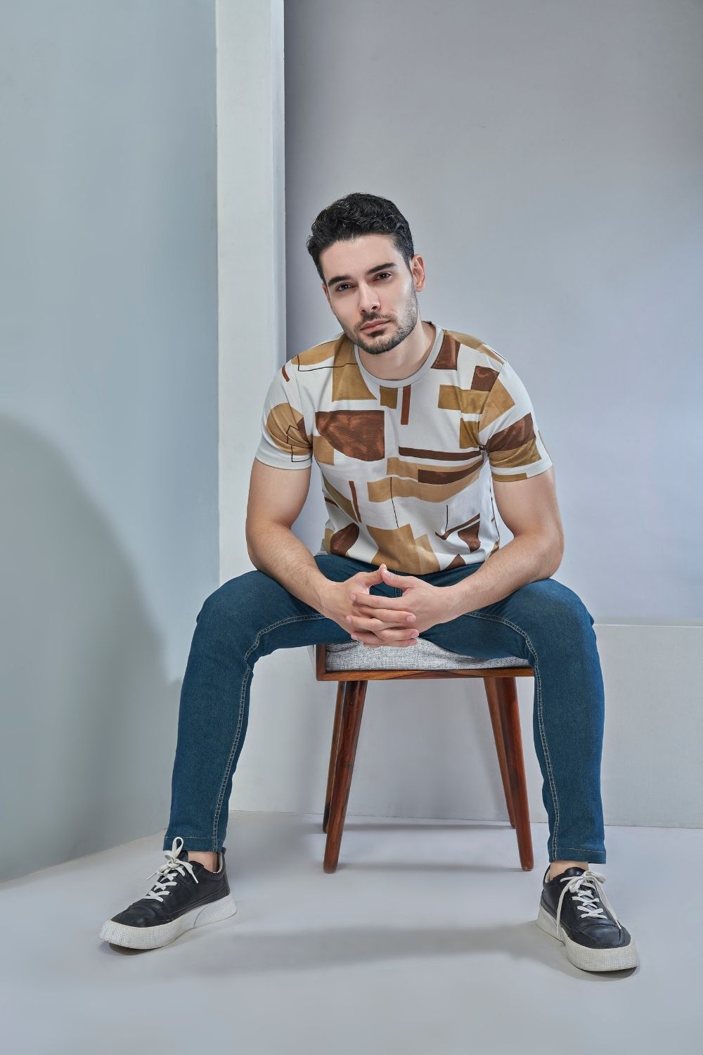 Golden brown colored, all over print T shirt for men with short sleeves and round neck.
