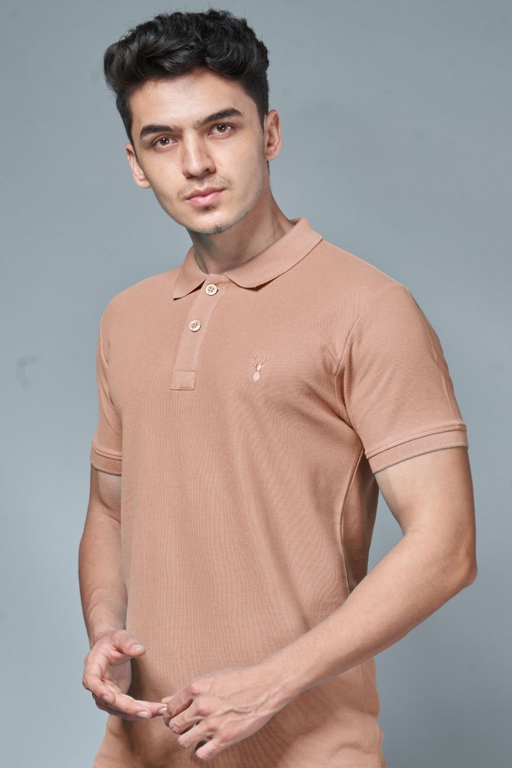 Bisque colored, identity Polo T-shirts for men with collar and half sleeves, side view.