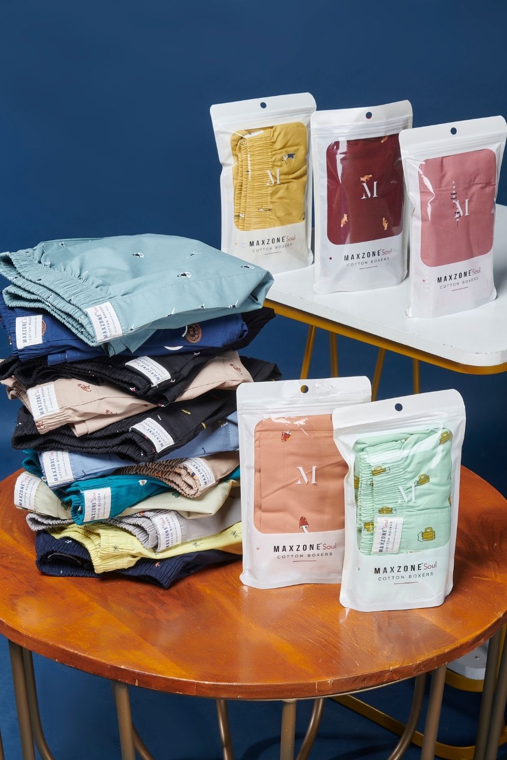 Packaging of coffee colored all over printed cotton boxer for men with back pockets.