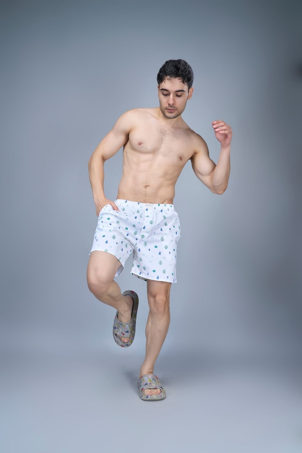 White colored all over printed cotton boxer for men with Side pockets, front.