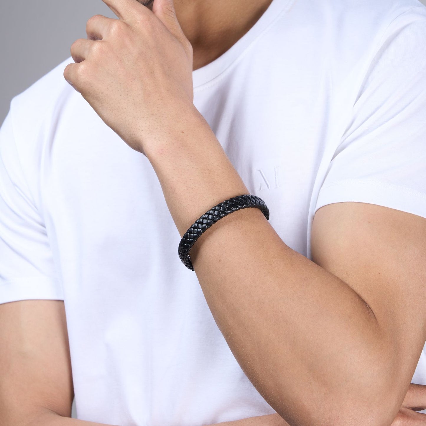 Black color, snake patterned Bracelet for men, with magnetic clasp, side view.