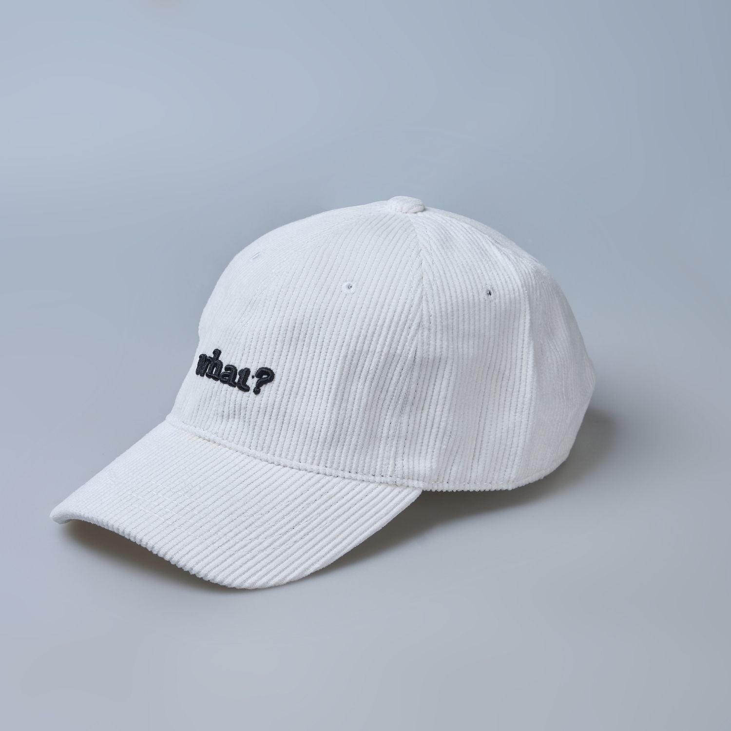 White colored cap for men with 'what' text written on it, design details..