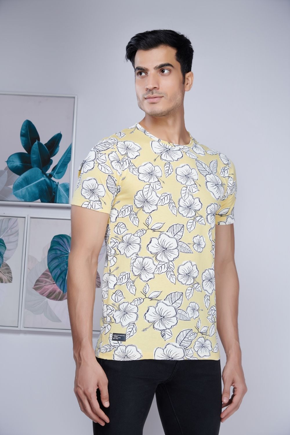 Direction style, floral patterned all over print T shirt for men with half sleeves and round neck, close up.
